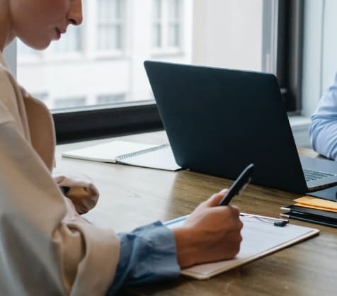Person filling out a contract